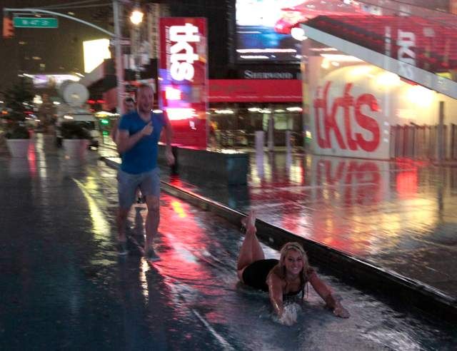 People in Times Square decide the bike lanes are obviously for Slip 'n Slide